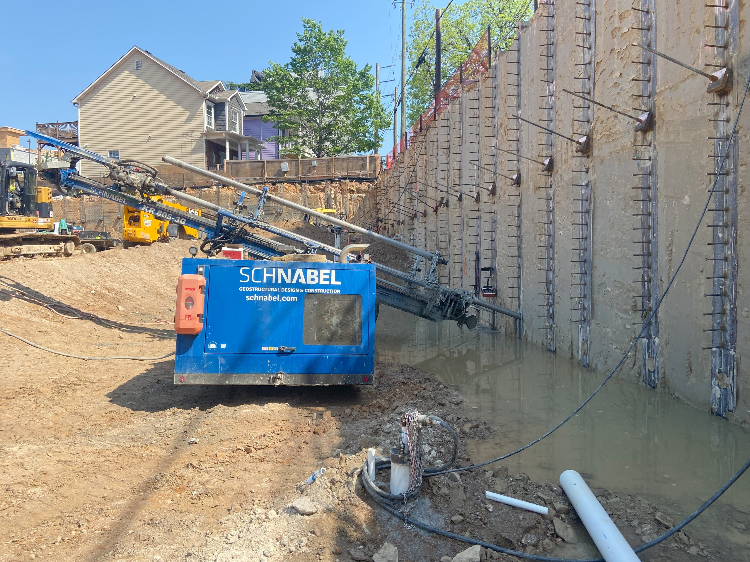 Wall drill being used to build permanent retaining walls in Sterling, VA